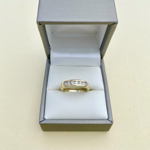 9ct. Gold Channel Set Half-Eternity Ring with 7 Diamonds.