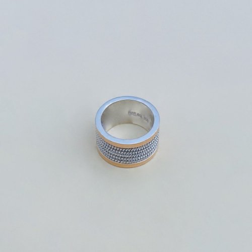 Silver Band with 18ct. Gold Border.