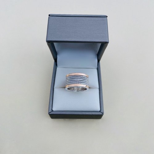 Silver Band with 18ct. Gold Border.