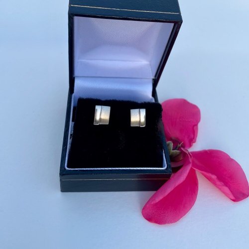 Sterling silver small stud earrings.