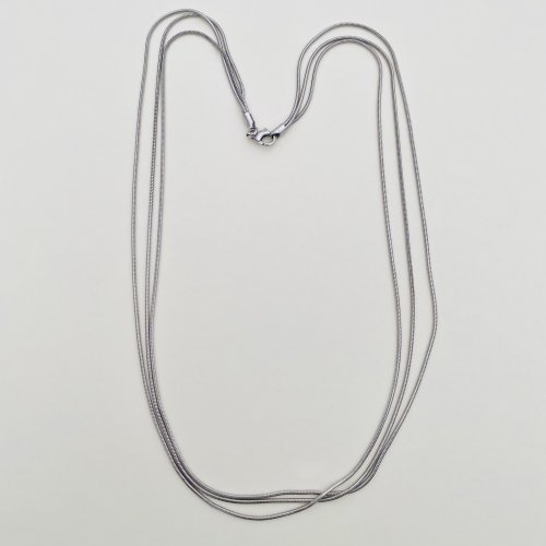 Sterling silver triple snake chain.