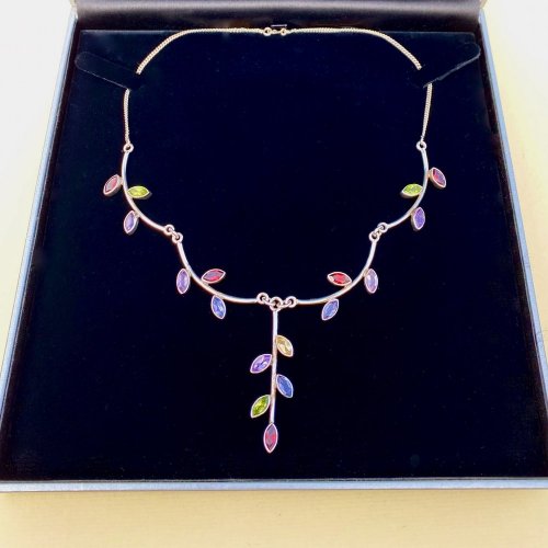 Sterling silver necklace with multi-coloured gemstones.