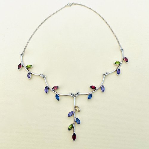 Sterling silver necklace with multi-coloured gemstones.