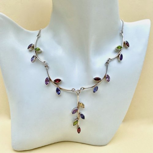 Sterling silver necklace with multi-coloured gemstones.