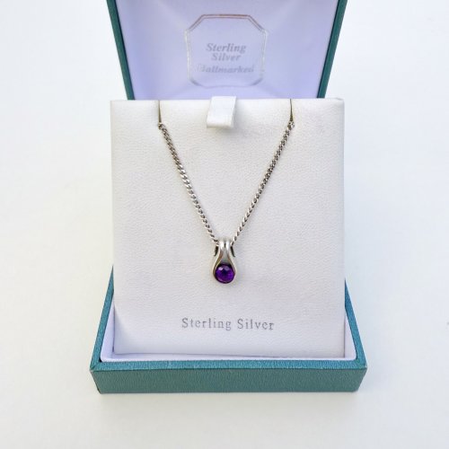 Silver / amethyst pendant.