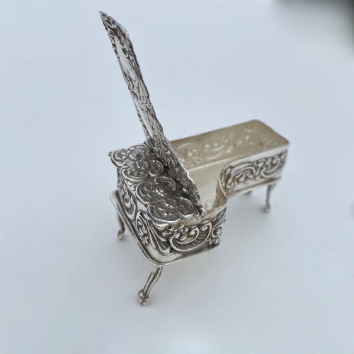 Miniature embossed silver baby grand style piano box.