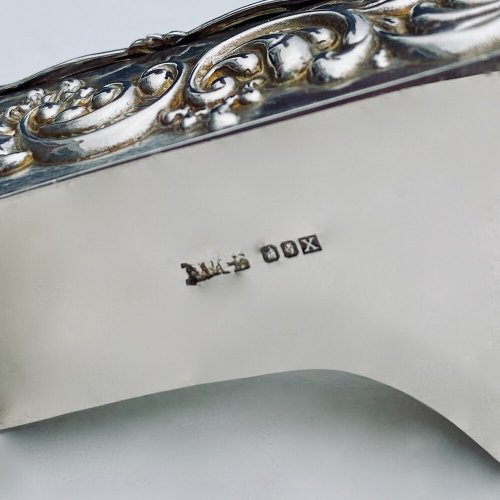 Miniature embossed silver baby grand style piano box.