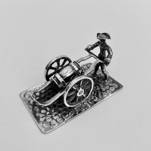 Miniature model of man transporting barrel. Circa 1950.