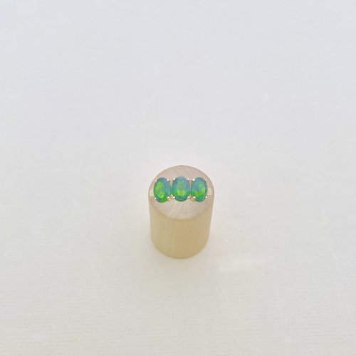 10ct. Gold Ring set with 3 Oval Green Gemstones.