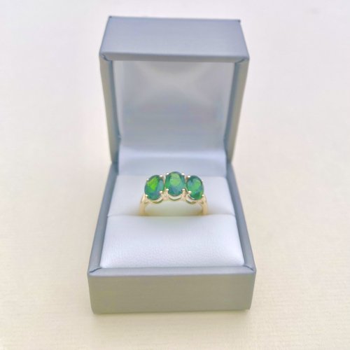 10ct. Gold Ring set with 3 Oval Green Gemstones.