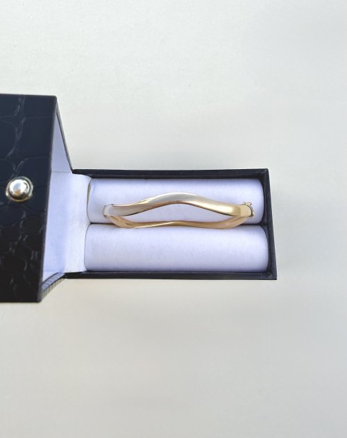 Contemporary 9ct. Yellow Gold Wave Bangle. NEW STOCK.
