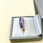 9ct. Gold Ring / Purple Gemstones.