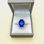 9ct. Oval Blue Gemstone &amp; Diamond Ring.