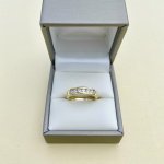 9ct. Gold Channel Set Half-Eternity Ring with 7 Diamonds.