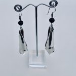 Designer silver scroll drop earrings.