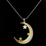 Crescent Shaped Pendant with Stars.