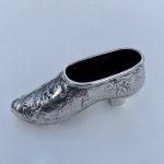 Miniature model of shoe, romantic theme. Circa 1900.