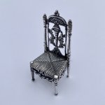 Miniature silver set table and chairs.