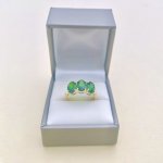 10ct. Gold Ring set with 3 Oval Green Gemstones.